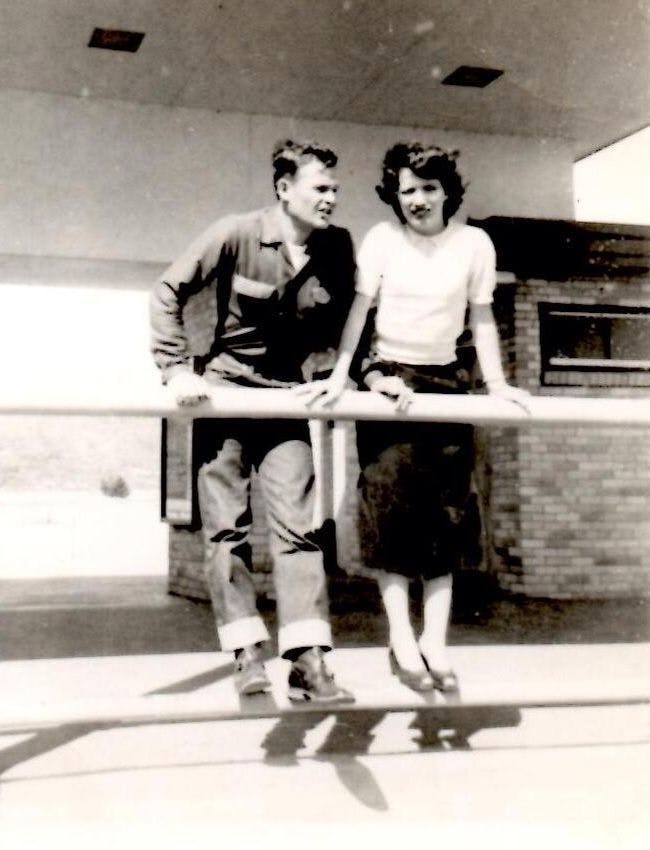 Old photograph of Casey's grandparents, shortly after they married, standing
on the rail of an overlook.
