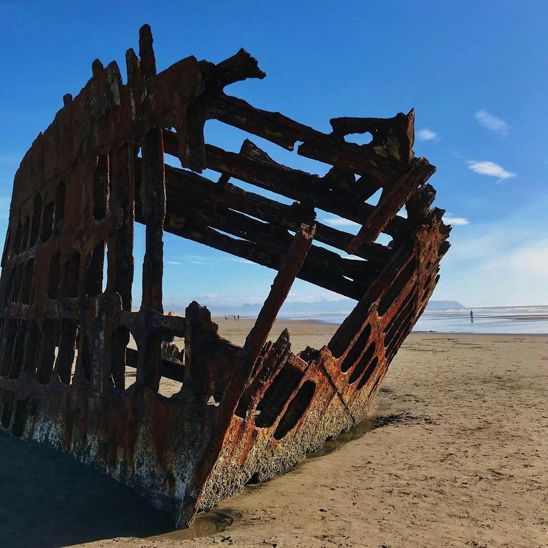 Steel frame from the remains of a shipwreck on the beach.